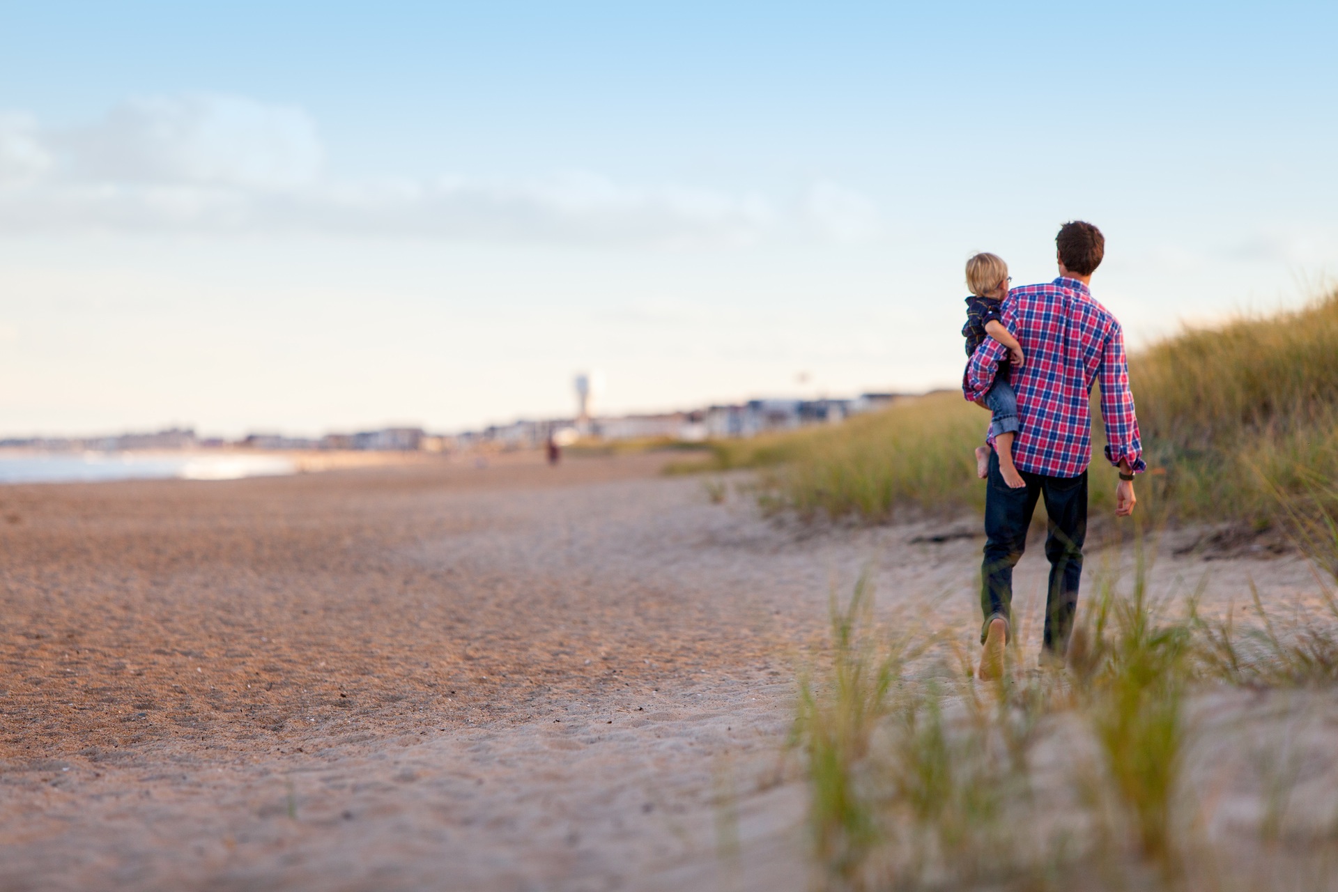 a man and child at the beach